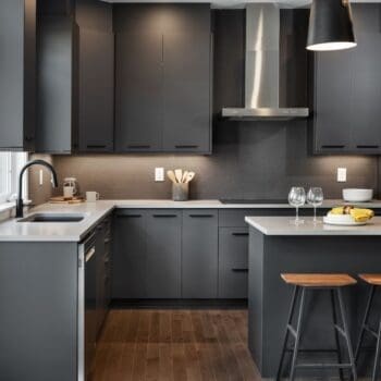 Charcoal coloured kitchen cabinets and island