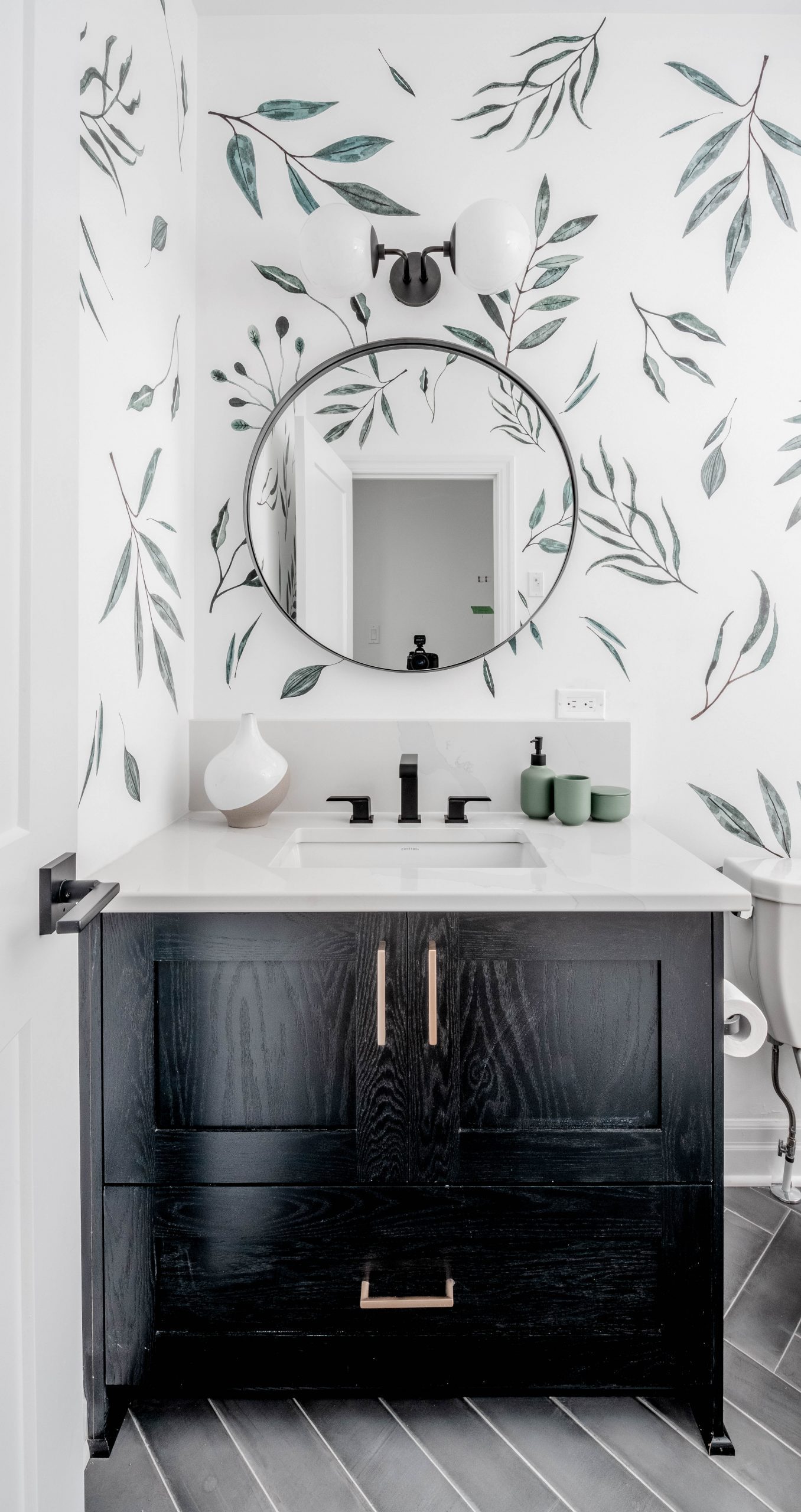 Plant leaf wallpaper with black vanity bathroom