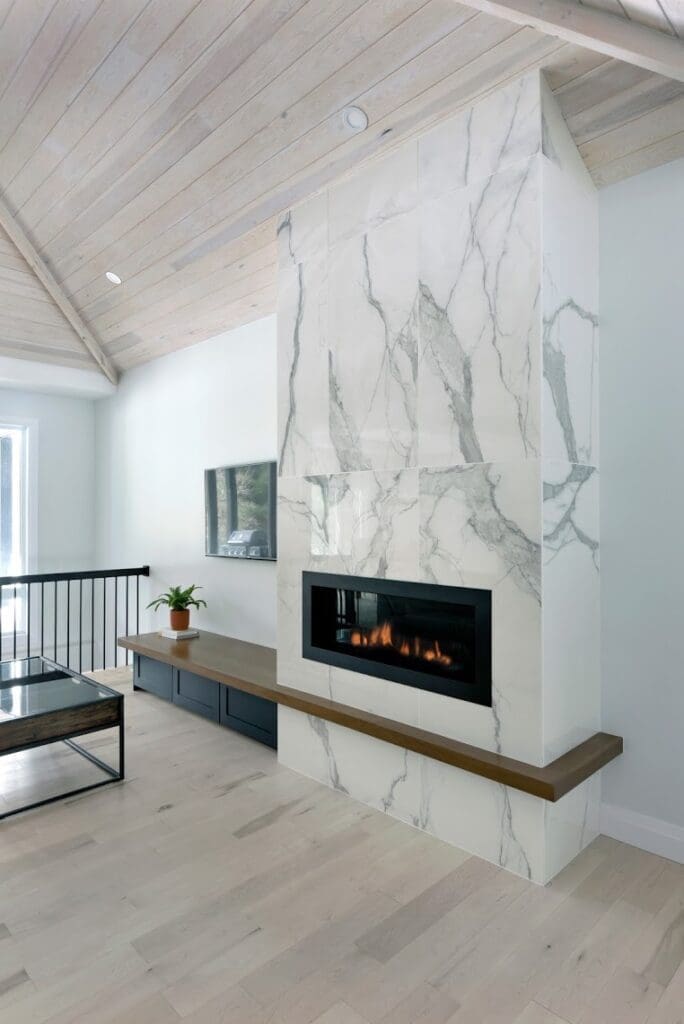 Vaulted wooden ceiling with marble fireplace